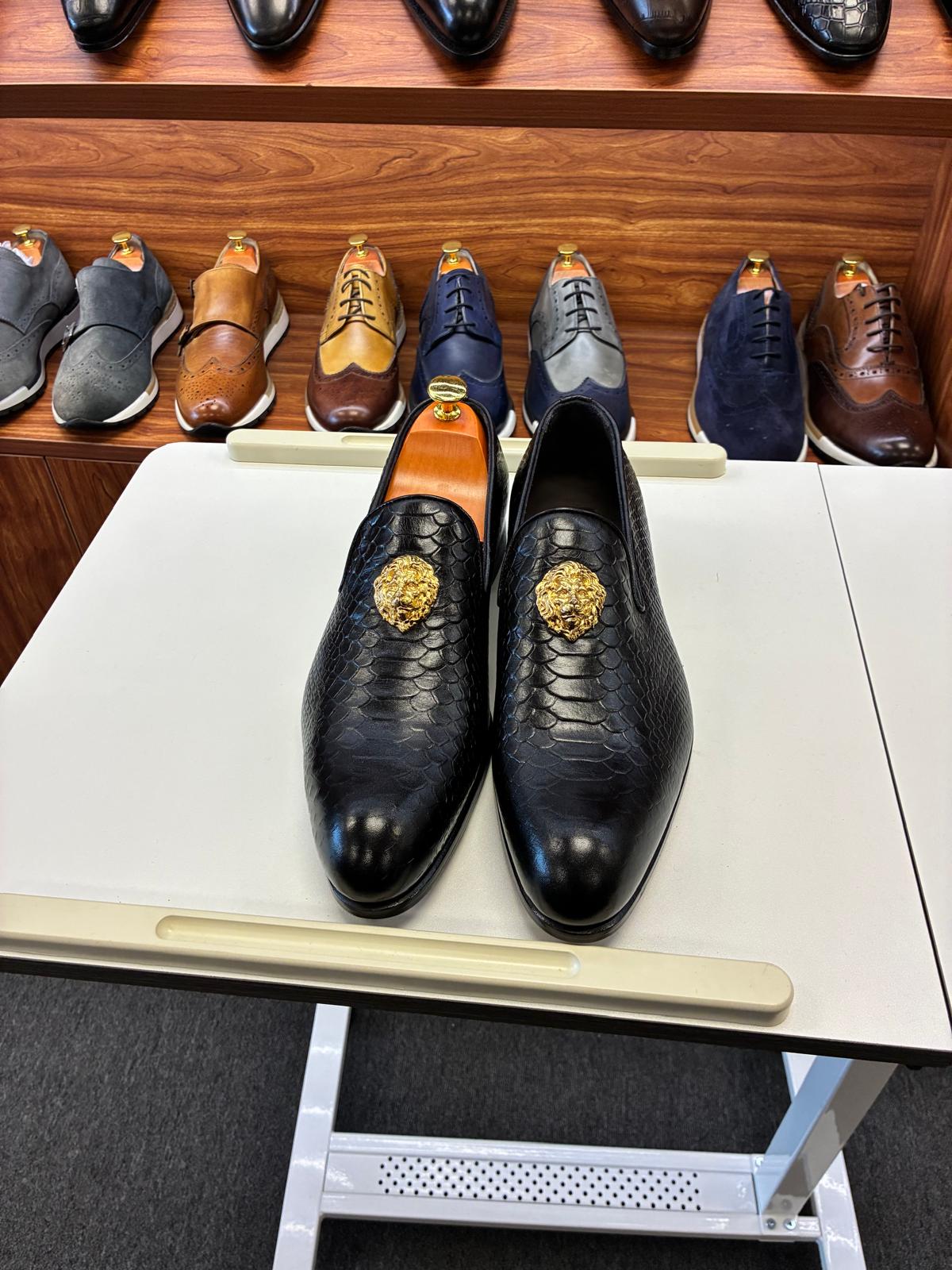 Men’s Black Textured Leather Loafers with Gold Emblem